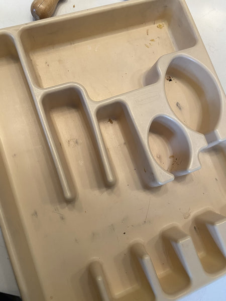 How are there always crumbs in the silverware drawer holder?